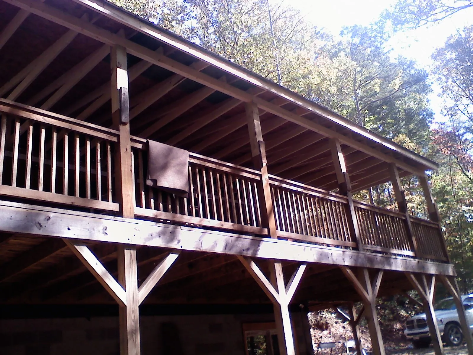 Timber framing under a new elevated porch and deck — Roof Leak Repair in Phippsburg by Roofing Brothers